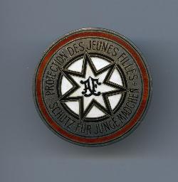 "Protection des jeunes filles - Schutz für junge Mädchen" Brosche, rund (siebenzackiger Stern)
